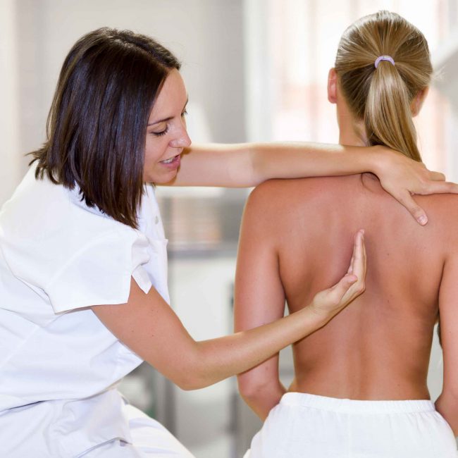 Medical check at the shoulder in a physiotherapy center.